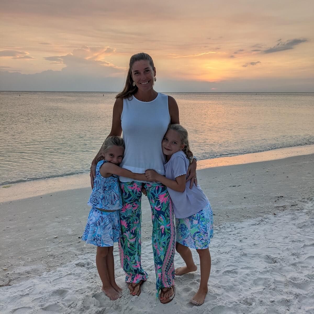 Kelly Carr with her two kids on the beach